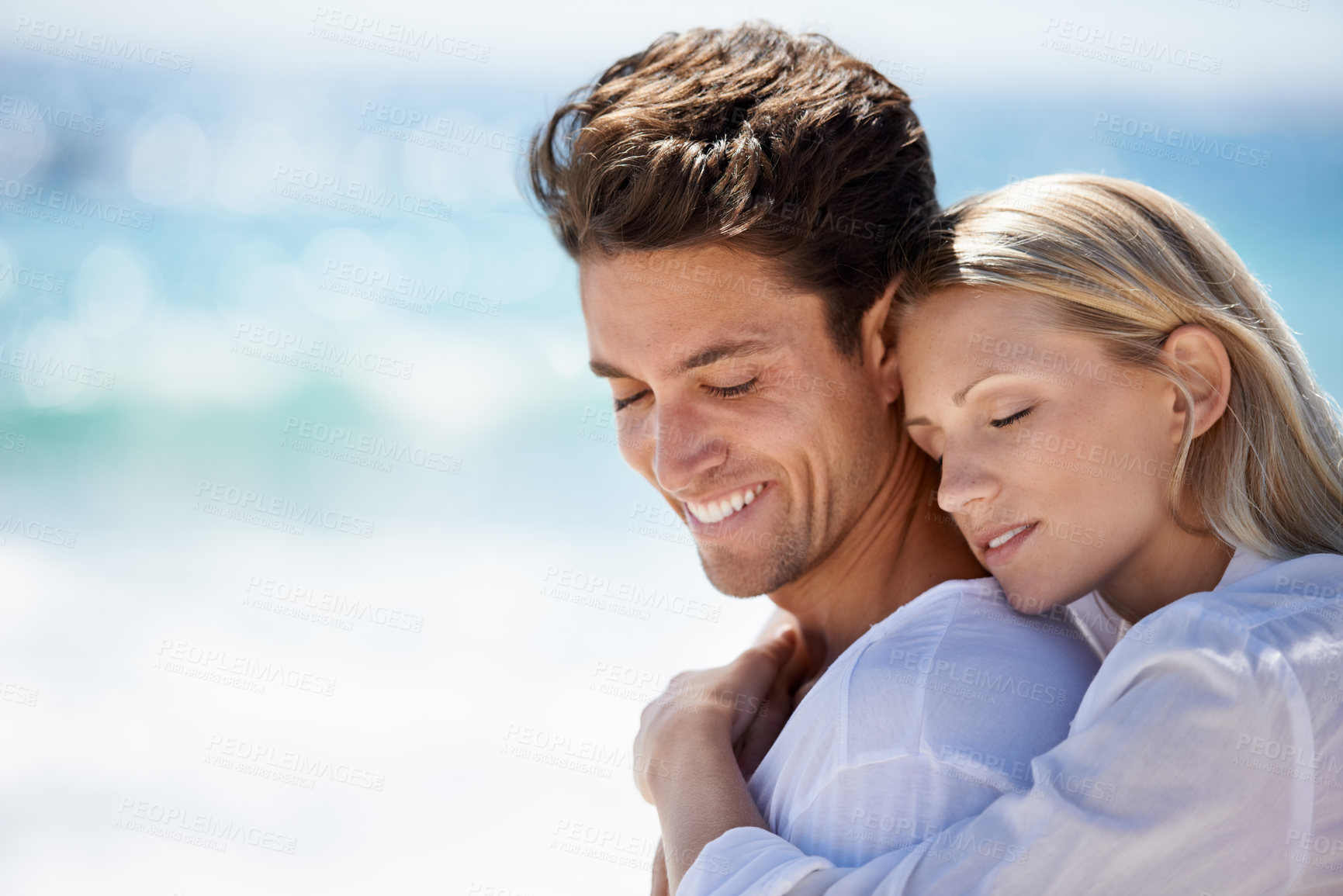 Buy stock photo Happy, couple and hug by the beach on travel, vacation and trip date with a smile and embrace. Romance, summer and holiday by the sea and ocean with young people together on a break in Miami outdoor