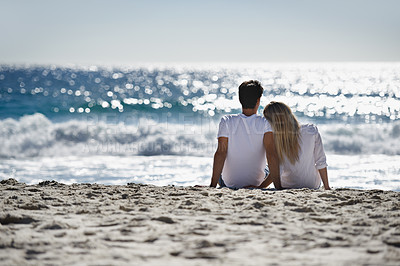 Buy stock photo Love, bonding and couple sitting on beach for date, outdoor fun and tropical holiday. Romance, man and woman at sea, thinking and relax on ocean vacation together with travel, care and adventure.