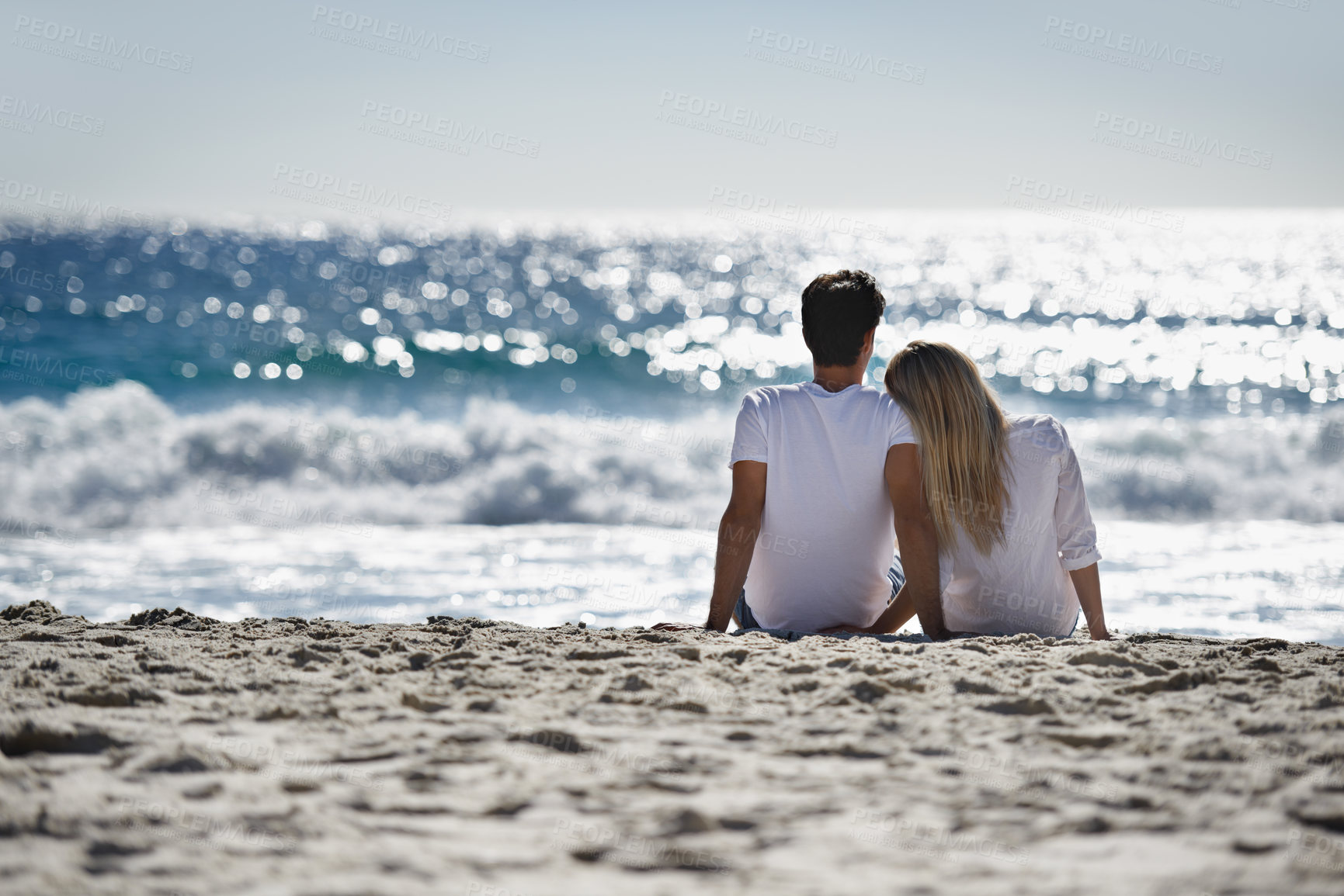 Buy stock photo Love, bonding and couple sitting on beach for date, outdoor fun and tropical holiday. Romance, man and woman at sea, thinking and relax on ocean vacation together with travel, care and adventure.
