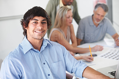 Buy stock photo Design, team and portrait of man in meeting with project, collaboration and creative planning in office. Happy, person and photographer work at table with catalog, portfolio and editing process
