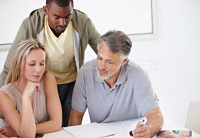 Buy stock photo A group of designers having a discussion in their office
