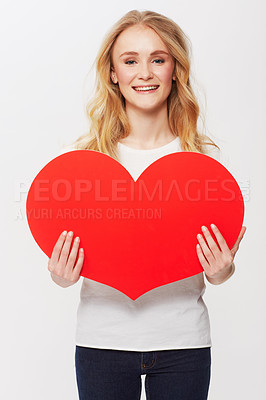 Buy stock photo Young woman, red heart and portrait in studio for happiness, love and valentines day in casual fashion. American model, positive and face with care symbol for affection and gen z by white background