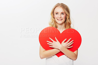 Buy stock photo Young woman, red heart or happiness in studio for wellness, love or romantic review on valentines day. American model, positive and smile with care symbol for support and opinion by white background