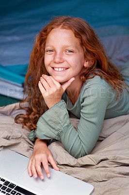 Buy stock photo Child, relax and portrait with laptop in bed with happiness to play online games for holiday or vacation. Kid, smile and scroll on computer website, streaming movie or elearning with internet