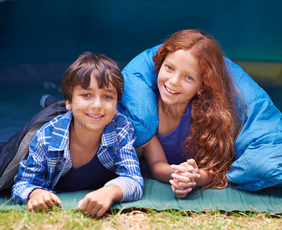 Buy stock photo Happy, camping and portrait of children in sleeping bag for resting, relax and comfortable in tent. Travel gear, smile and kids in sleep sack for adventure on holiday, vacation and weekend outdoors
