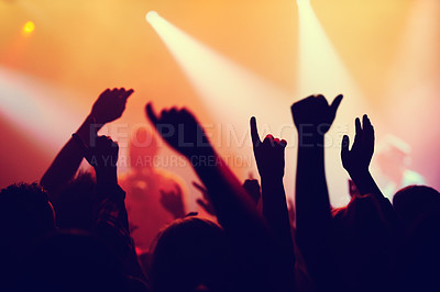 Buy stock photo Party, concert and hands of people in audience or crowd with energy for dance event at night. Music, light and festival with group of fans at rock or disco performance on stage for celebration
