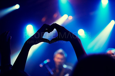 Buy stock photo A young person showing "love and light" to the band on stage. This concert was created for the sole purpose of this photo shoot, featuring 300 models and 3 live bands. All people in this shoot are model released.