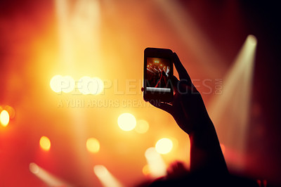 Buy stock photo Hands, smartphone or image of performance at concert, music event or audience with flashlight in bokeh. Person, photography or online on cellphone, technology or celebration with crowd for live band