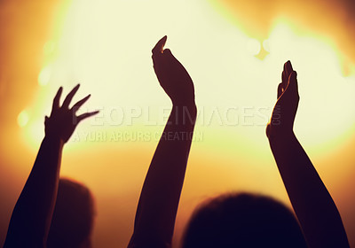 Buy stock photo Concert, applause and hands of people in audience or crowd with energy for dance party at night. Music, light and event with group of fans at rock performance on stage for celebration festival