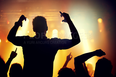 Buy stock photo Party, concert and crowd of people at festival with energy for dance event at night from back. Music, light and audience with group of fans at rock or disco performance on stage for celebration