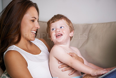 Buy stock photo Happy sofa or mom with toddler in home for care, love or smile together to nurture child development. Relax, laugh or single parent mother with baby, boy or kid for support or trust in family house 