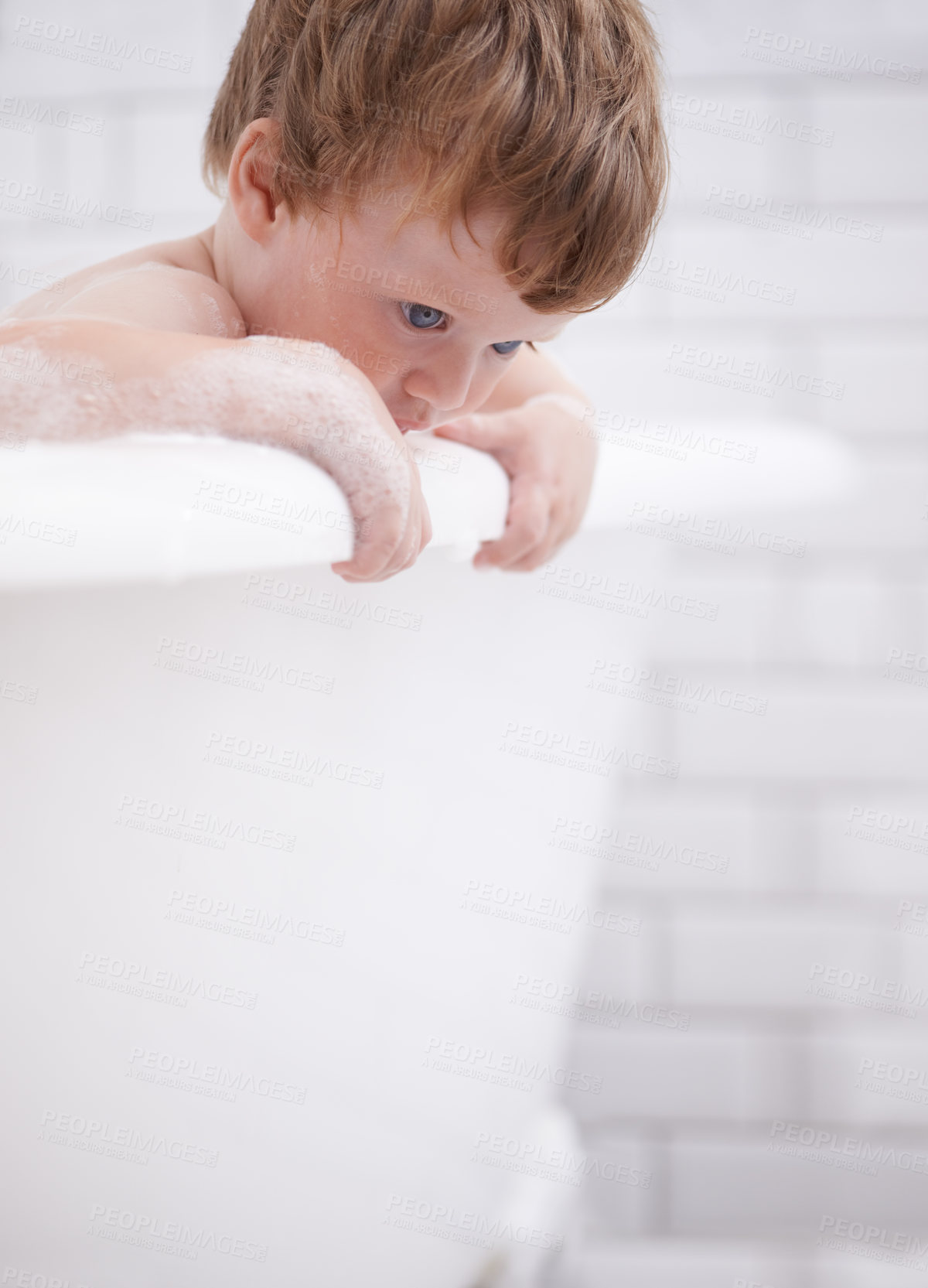 Buy stock photo Baby, bath and clean with bubbles and curious in the bathroom at home for hygiene. Grooming, fresh and boy child cleaning for bodycare in the house while thinking for development and adorable growth