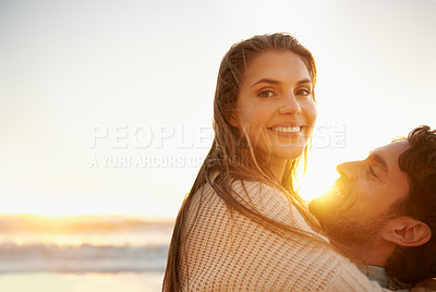 Buy stock photo Smile, embrace and portrait of couple at beach on vacation, adventure or holiday for valentines day. Sunset, love and man carry, hug and bond with woman by ocean for weekend trip on romantic date.