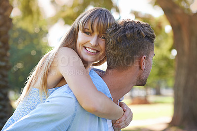 Buy stock photo Piggy back, smile and couple in a park, love and fun with weekend break or bonding together. Portrait, man carrying woman or marriage with happiness or relationship with romance or outdoor for a date