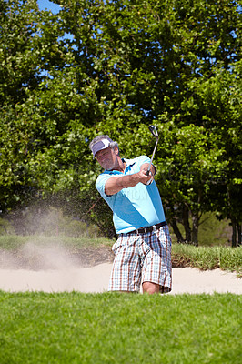Buy stock photo Senior, sand and man playing golf in pit, lawn or green grass or field for sports, swing or shot on course. Mature male person, golfer or player hitting difficult ball for game or point in nature