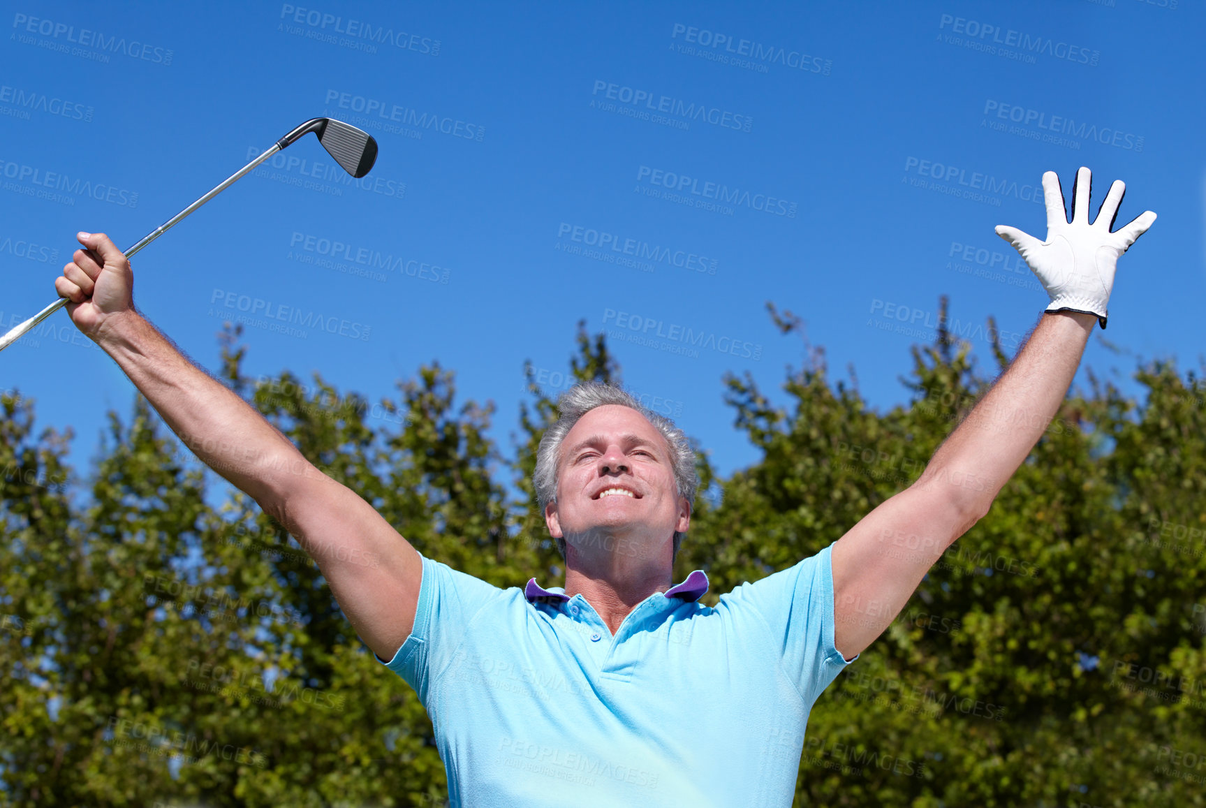 Buy stock photo Winner, sports and old man with hands up in golf celebration on blue sky background with smile. Champion, success and senior male golfer celebrating achievement, winning and training, game or goal
