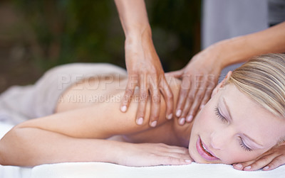 Buy stock photo Hands of masseuse, woman getting massage in spa and wellness with peace, tranquility and holistic treatment. Stress relief, zen and female person at luxury resort with self care and body healing
