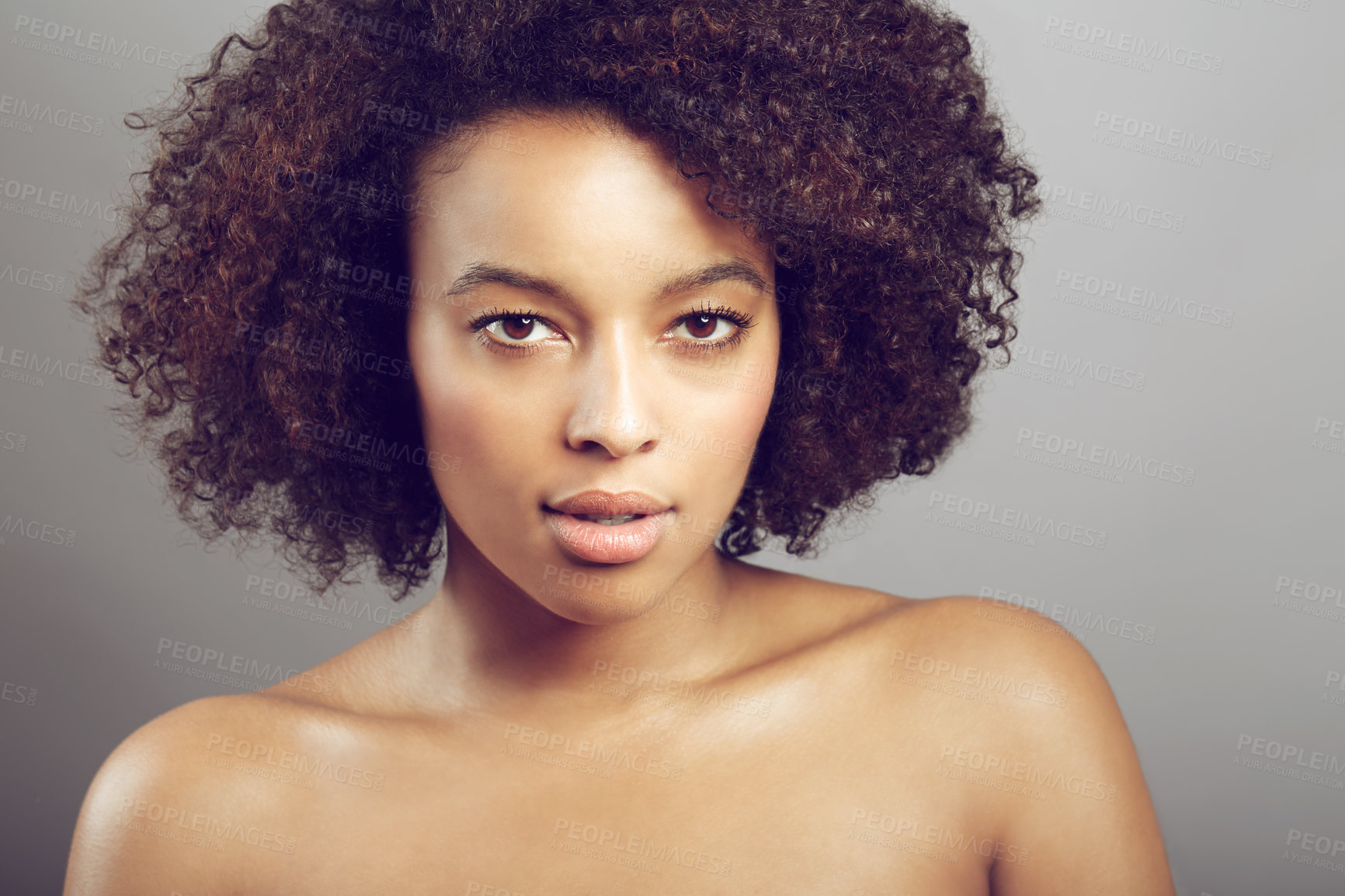 Buy stock photo Serious, portrait and a black woman for skincare and beauty isolated on studio background. Wellness, dermatology and face of an African girl with a glow from care for skin and cosmetic salon results