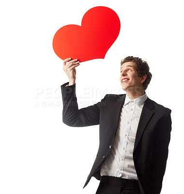 Buy stock photo A young man holding a heart symbol in front of a white background