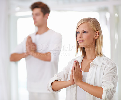 Buy stock photo Meditation, prayer hands and people in a studio with peace, zen and mental health, wellness or balance. Mindfulness, relax and team with holistic, breathing or yoga exercise for spiritual awareness