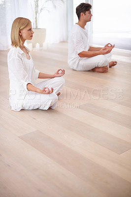 Buy stock photo Meditation, lotus hands and couple on a floor for peace, balance and spirituality in their home together. Balance, profile and people in a living room for zen, stress relief or holistic self care