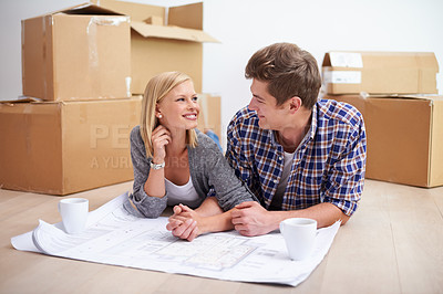 Buy stock photo Man, woman and happy with floor plan blueprints for home renovation or moving boxes, apartment or investing. Couple,  ground and paper for house development for improvement, buying or new beginning
