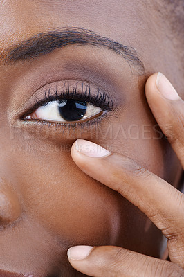 Buy stock photo Eye, closeup and black woman with beauty, vision and skincare with dermatology. Half, portrait and African model with natural makeup and nails on face with healthy skin from cosmetics or facial