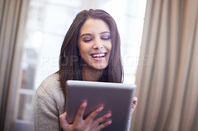 Buy stock photo Woman, browsing and tablet for comedy and laughing, app and scrolling on social media at home. Female person, smile and internet connection for comic, technology and funny or silly humor on weekend