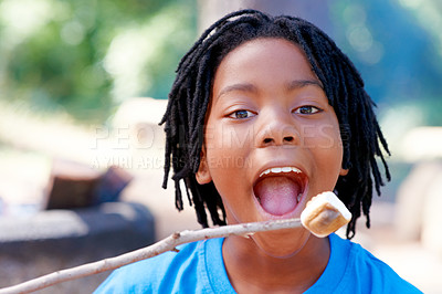 Buy stock photo Boy, camping and happy for marshmallow in portrait, hungry and fire for roast candy in forest. African child, summer break  and smile on face for sugar snack, hiking and nature for holiday adventure