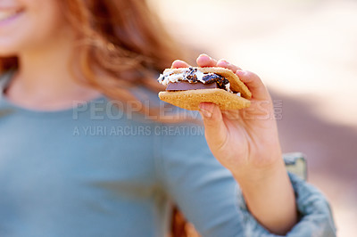 Buy stock photo Cropped view of a little girl holding a delicious smore