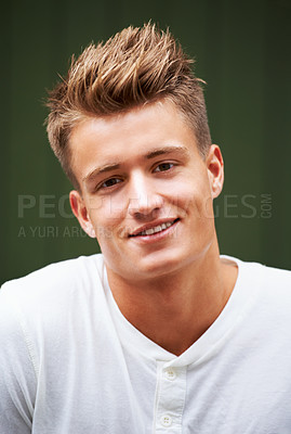 Buy stock photo Portrait of a handsome young man standing outside