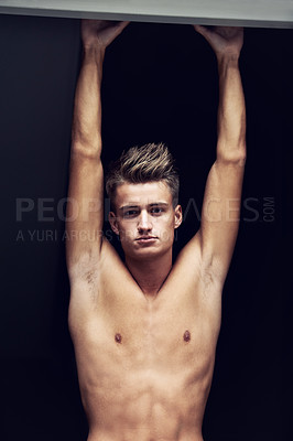 Buy stock photo Shirtless, body and portrait of young man looking serious on a dark background with strength. Topless, muscles and face of a caucasian male person from Norway with confidence and pride for his chest