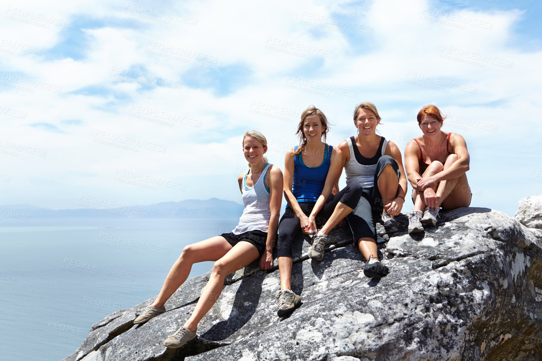 Buy stock photo Happy, friends and portrait of women on mountain cliff for rock climbing, freedom and travel vacation. Sports, hiking and adventure with people on rock in nature for trekking, training and mockup