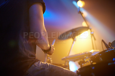 Buy stock photo A young drummer rocking out on stage