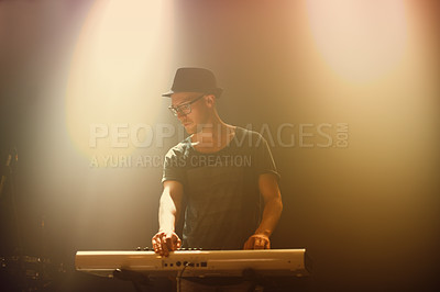 Buy stock photo Music, concert and man playing keyboard for performance at night with glasses in entertainment. Musician, artist and instrument for party and culture song at nightclub on new years eve at festival
