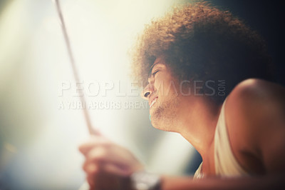 Buy stock photo Man, drummer and musician in performance at stage for rock concert, music festival and energy. Person, artist and play wiht drumstick for entertainment, sound and rehearsal on percussion instrument