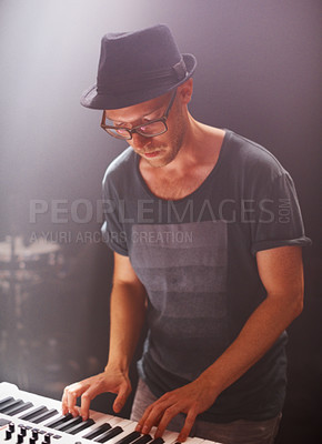 Buy stock photo Jazz musician, playing and piano on stage at night for solo performance and album launch in Canada. Hipster with electronic keyboard at rock, music and festival for sound, audio and live gig 