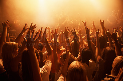 Buy stock photo Music, concert and crowd of people dancing for performance with lighting equipment at party. Event, entertainment and group of fans or audience at festival, disco or rave with energy for song.
