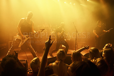 Buy stock photo Music, concert and band on a stage with audience for performance with lighting equipment at party. Event, entertainment and group of musicians at festival, disco or rave with energy for crowd or fans