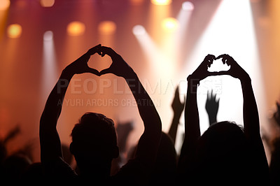 Buy stock photo Heart hands, love and silhouette at music festival, kindness and peace emoji or symbol at concert. People, audience and back of crowd at party or event, 