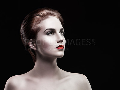 Buy stock photo A beautiful woman looking away with dark make up on