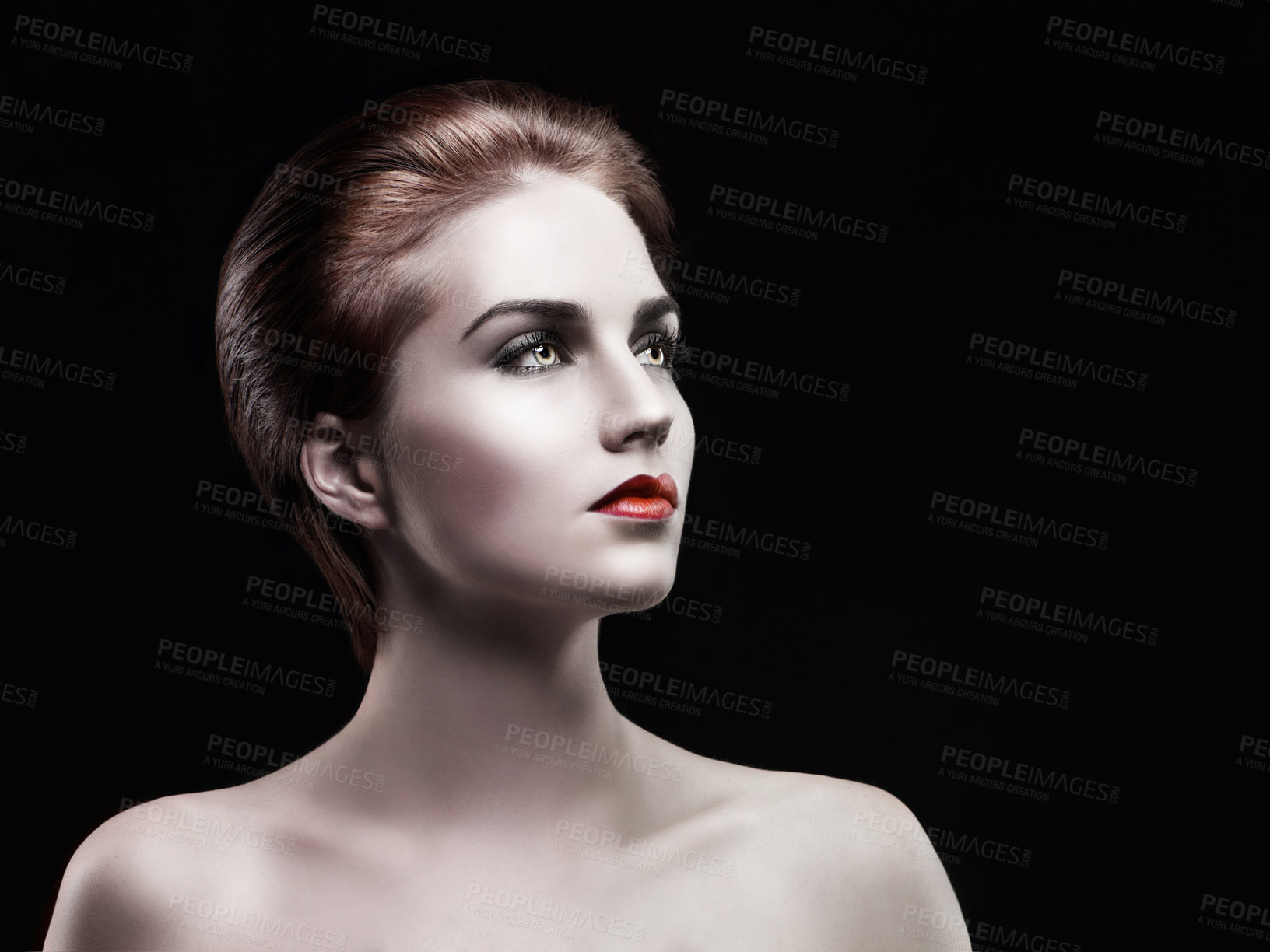 Buy stock photo A beautiful woman looking away with dark make up on