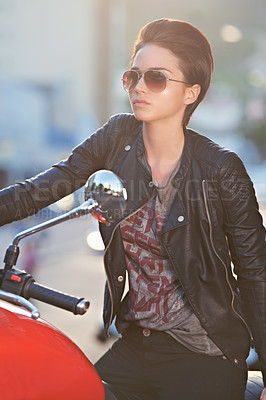 Buy stock photo Motorcycle, leather and biker in city with sunglasses for travel, transport or road trip as rebel. Fashion, street and woman with attitude on classic or vintage bike for transportation or journey