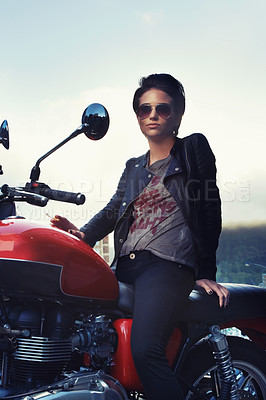 Buy stock photo Motorcycle, leather and rebel woman in city with sunglasses for travel, transport or road trip. Fashion, evening and person with attitude on classic or vintage bike for transportation or journey