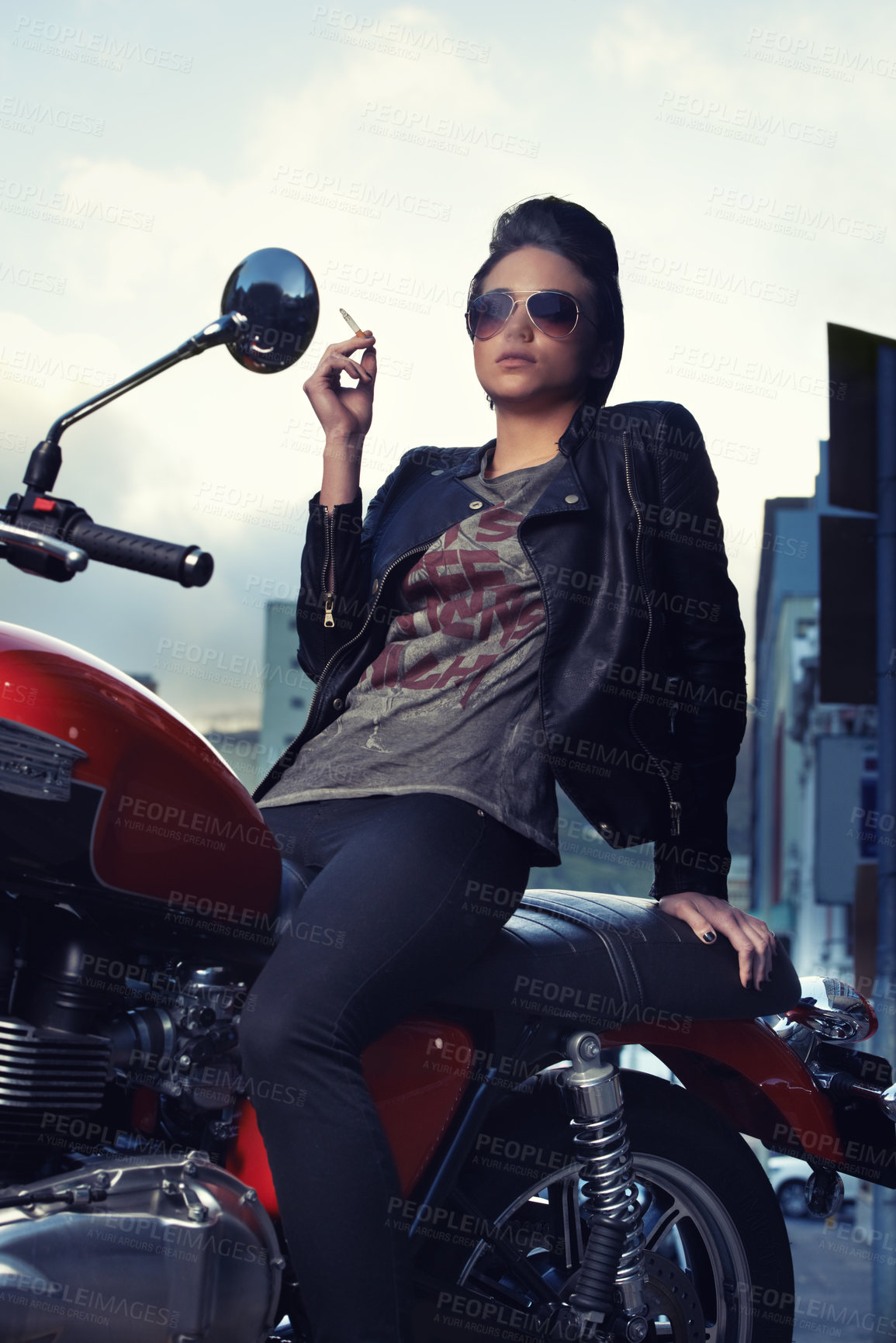 Buy stock photo Motorcycle, cigarette and woman smoking in city for travel, transport or road trip as rebel. Fashion, tobacco or nicotine and biker with attitude on classic or vintage bike for urban journey