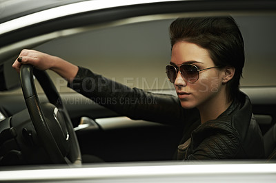 Buy stock photo A gorgeously stylish woman in shades in her luxury car