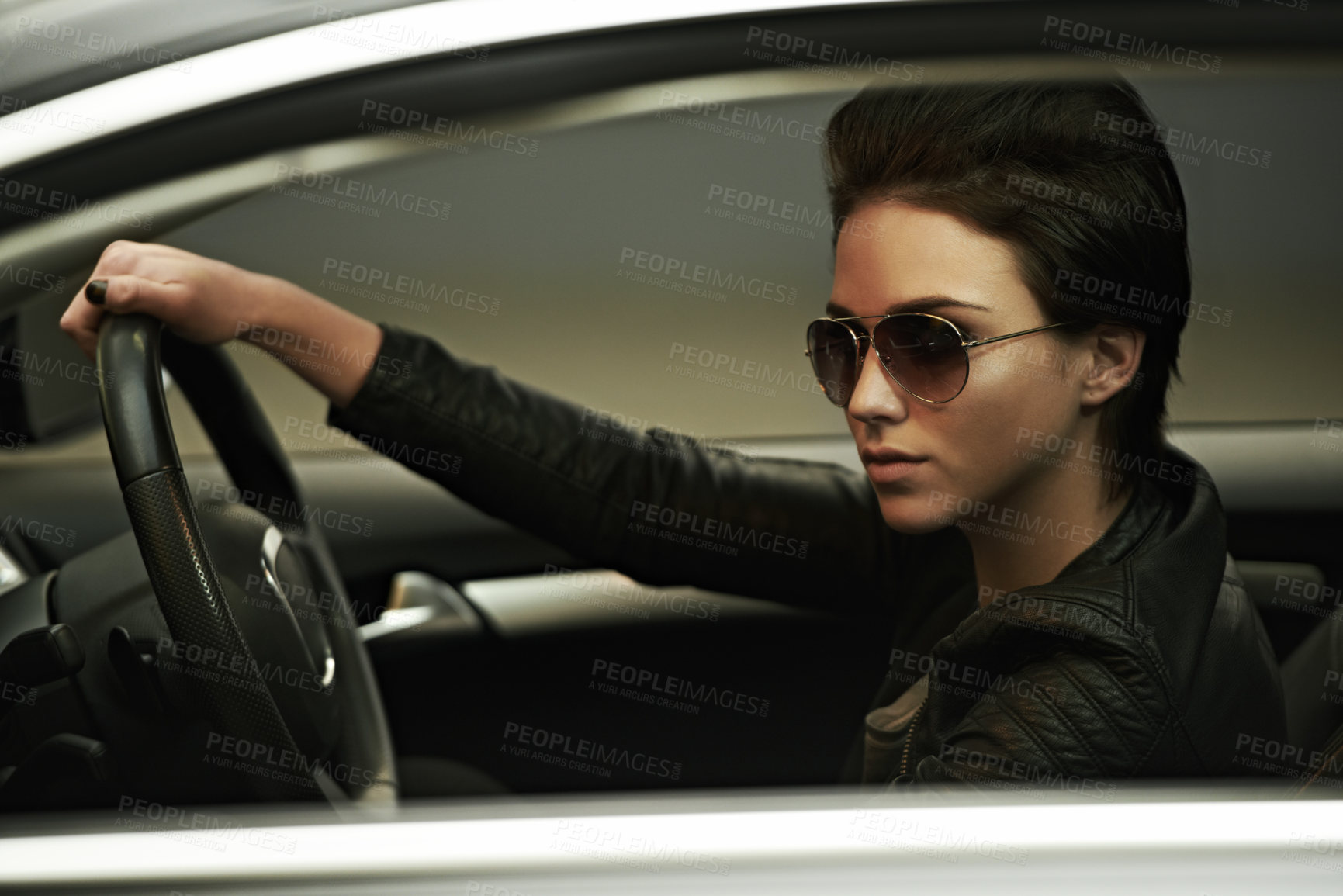 Buy stock photo A gorgeously stylish woman in shades in her luxury car