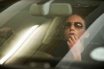 Buy stock photo Woman, driving and mirror to reverse from parking garage for journey or trip with sunglasses. Face, female person and car window to think on roadtrip in vehicle for commute with stylish eyewear