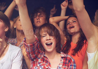 Buy stock photo Concert, audience and people singing at music festival, live performance or show for freedom, energy and happiness at club, nightclub or event. Men and women fans dancing at New years night party