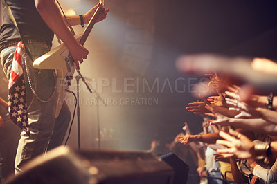 Buy stock photo Music artist, concert and playing guitar on stage for party, crowd or audience at a festival. Guitarist or rockstar in rock and roll band performing for fans at night event, club or music festival